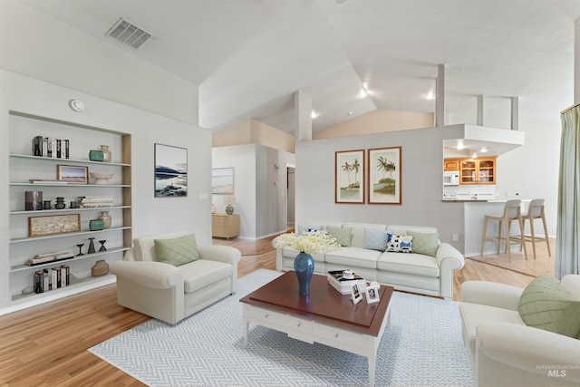 1728 S Labrador Pl, Meridian, ID 83642 - living room featuring wood finished floors and lofted ceiling