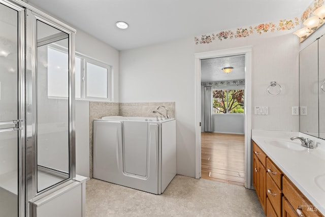 1728 S Labrador Pl, Meridian, ID 83642 - bathroom with double vanity, an enclosed shower, and a bath