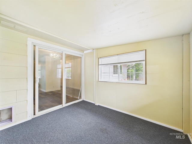 1409 Blane, Emmett, ID 83617 - spare room with carpet flooring, a chandelier, and baseboards