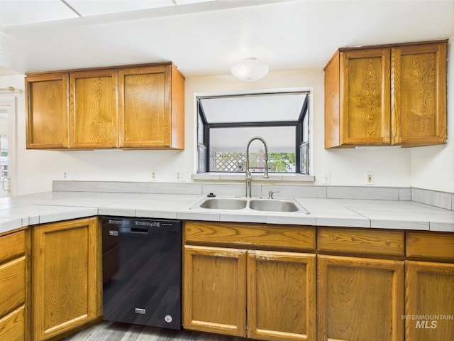 1409 Blane, Emmett, ID 83617 - kitchen with black dishwasher, a sink, and brown cabinets