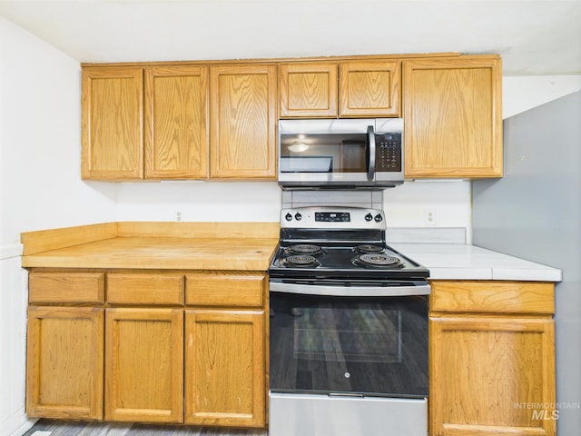 1409 Blane, Emmett, ID 83617 - kitchen with appliances with stainless steel finishes and butcher block counters