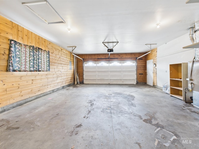 1409 Blane, Emmett, ID 83617 - garage with wooden walls and a garage door opener