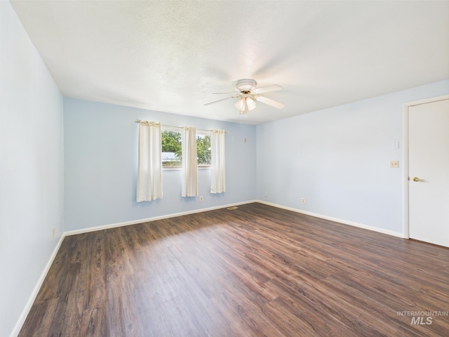 1409 Blane, Emmett, ID 83617 - empty room with ceiling fan, dark wood-type flooring, and baseboards