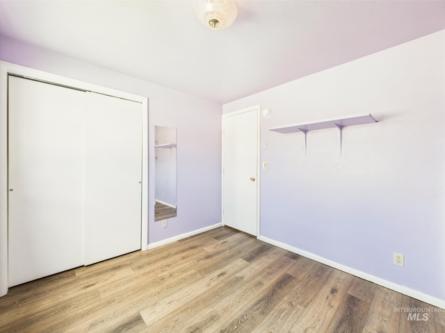 1409 Blane, Emmett, ID 83617 - unfurnished bedroom featuring wood finished floors, a closet, and baseboards