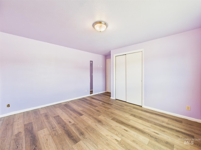 1409 Blane, Emmett, ID 83617 - unfurnished bedroom with wood finished floors, baseboards, and a closet