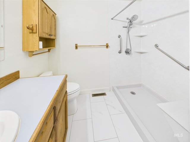 1409 Blane, Emmett, ID 83617 - bathroom featuring a shower, toilet, vanity, and marble finish floors