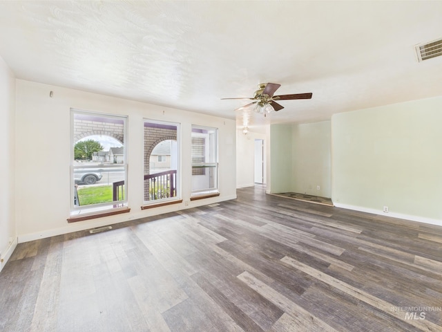 1409 Blane, Emmett, ID 83617 - unfurnished living room featuring wood finished floors, a ceiling fan, and baseboards