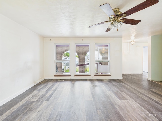 1409 Blane, Emmett, ID 83617 - empty room featuring wood finished floors, baseboards, and a ceiling fan