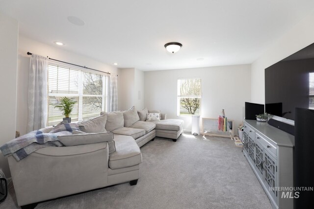 living room featuring a healthy amount of sunlight, carpet floors, and recessed lighting