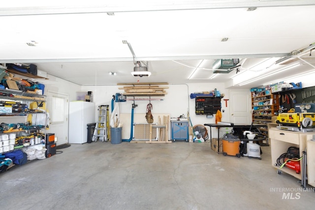 garage featuring a workshop area and a garage door opener