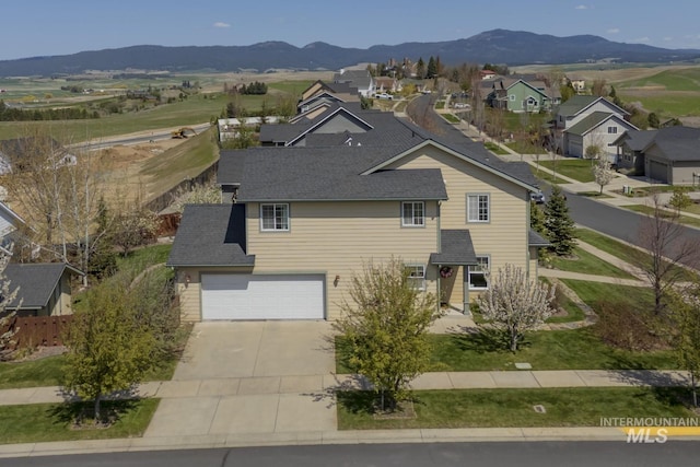 aerial view featuring a residential view and a mountain view