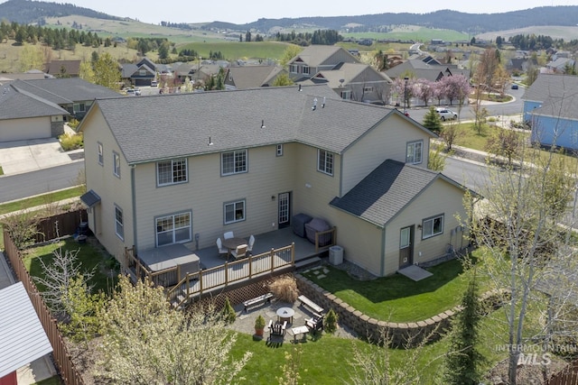 birds eye view of property featuring a mountain view and a residential view