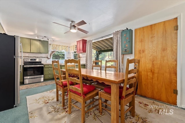 dining area featuring a ceiling fan