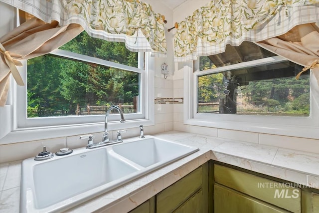 kitchen with light countertops and a sink