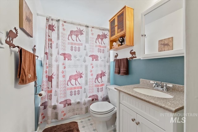 full bath featuring shower / tub combo, vanity, toilet, and tile patterned floors