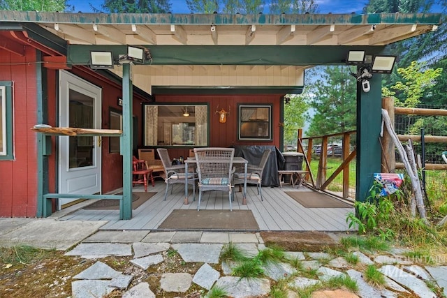 deck featuring outdoor dining area