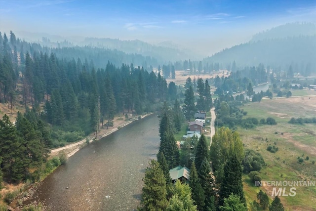 aerial view featuring a wooded view