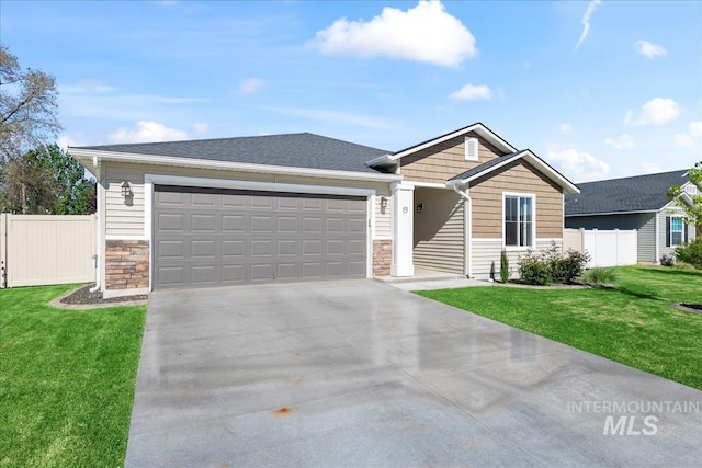 view of front of house with stone siding, concrete driveway, and a garage