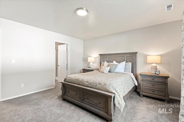 bedroom with carpet floors and baseboards