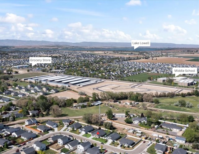 aerial view of residential area featuring a mountainous background