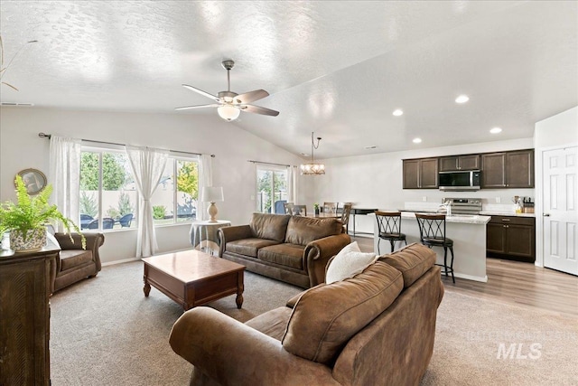 living room with vaulted ceiling, ceiling fan, recessed lighting, light carpet, and baseboards