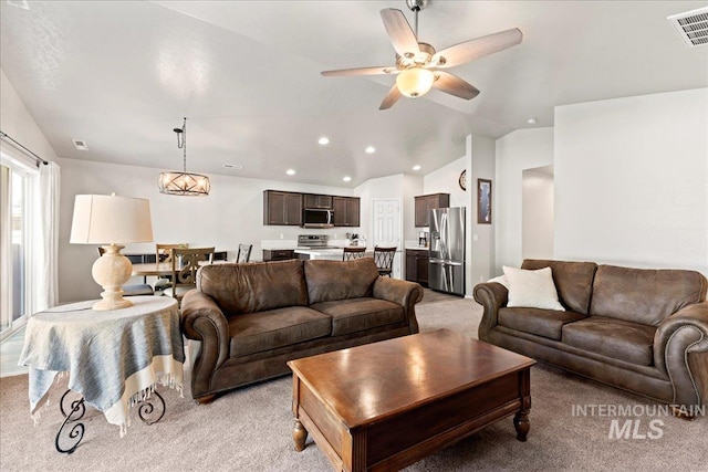 living room with light colored carpet, vaulted ceiling, recessed lighting, and ceiling fan