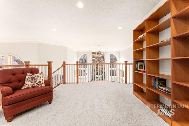 living area featuring carpet, crown molding, a textured ceiling, and recessed lighting