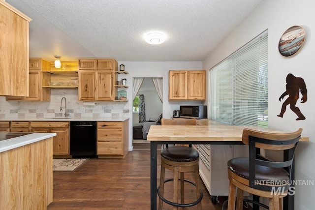 12456 S Lonnie Ln, Kuna, ID 83634 - kitchen featuring black dishwasher, open shelves, a sink, plenty of natural light, and a textured ceiling