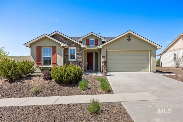 18555 N Goldenridge Pl, Boise, ID 83714 - view of front of property with concrete driveway, stone siding, stucco siding, and a garage