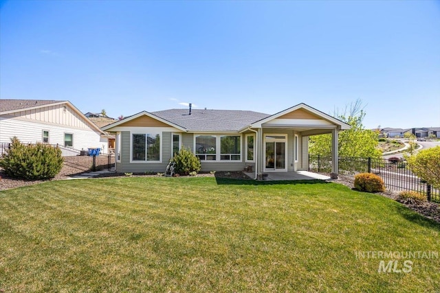 18555 N Goldenridge Pl, Boise, ID 83714 - back of house with a lawn, a patio, roof with shingles, and fence private yard