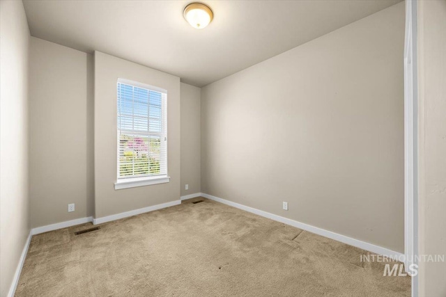 18555 N Goldenridge Pl, Boise, ID 83714 - carpeted spare room with baseboards and visible vents