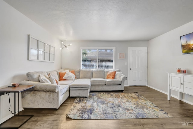 275 Elaine Ave Unit 2, Twin Falls, ID 83301 - living area with dark wood-style floors, a chandelier, and baseboards