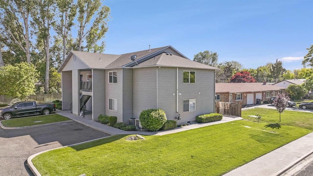 275 Elaine Ave Unit 2, Twin Falls, ID 83301 - view of home's exterior with a shingled roof