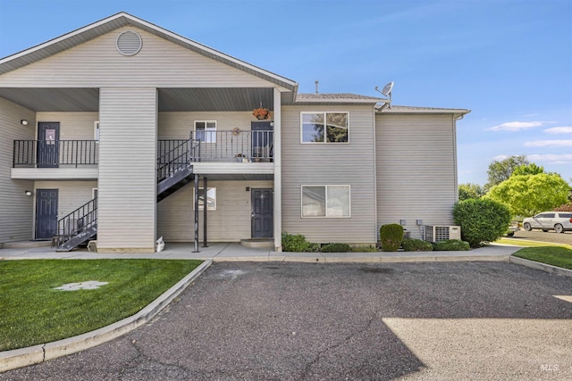 275 Elaine Ave Unit 2, Twin Falls, ID 83301 - view of property featuring stairway and central AC unit