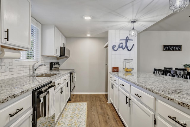 275 Elaine Ave Unit 2, Twin Falls, ID 83301 - kitchen featuring dishwasher, electric stove, a sink, light wood-style floors, and white cabinets