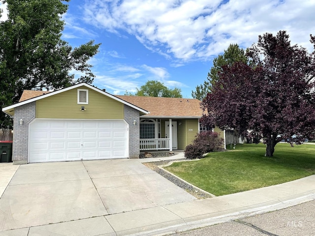 228 W Winnipeg St, Meridian, ID 83642 - ranch-style house featuring a front yard, an attached garage, a porch, driveway, and roof with shingles