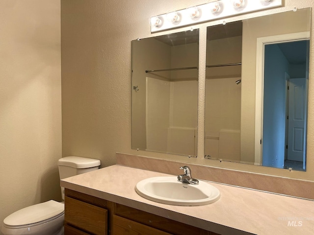 228 W Winnipeg St, Meridian, ID 83642 - full bathroom featuring toilet, vanity, and a shower