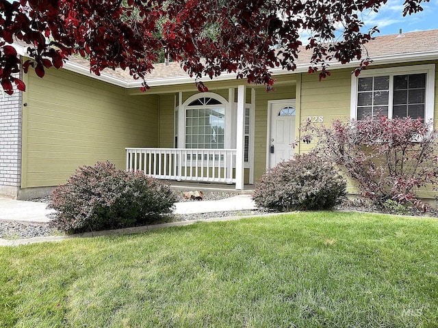 228 W Winnipeg St, Meridian, ID 83642 - view of exterior entry featuring covered porch and a lawn