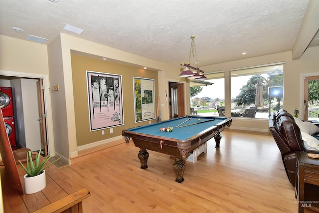 playroom featuring light wood-style flooring, baseboards, pool table, and a textured ceiling