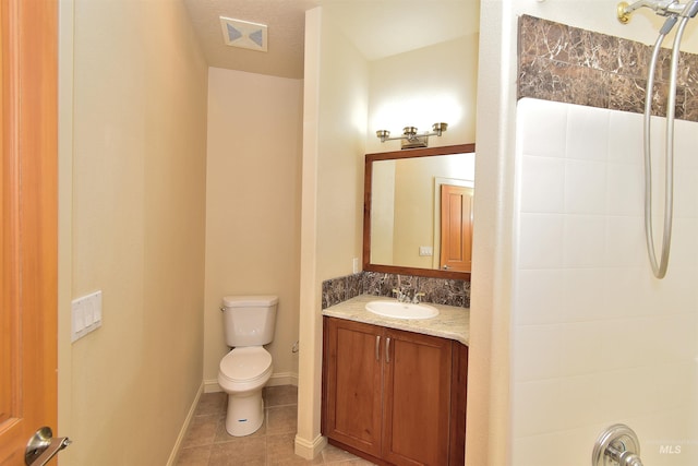 full bathroom with vanity, visible vents, toilet, tile patterned floors, and baseboards