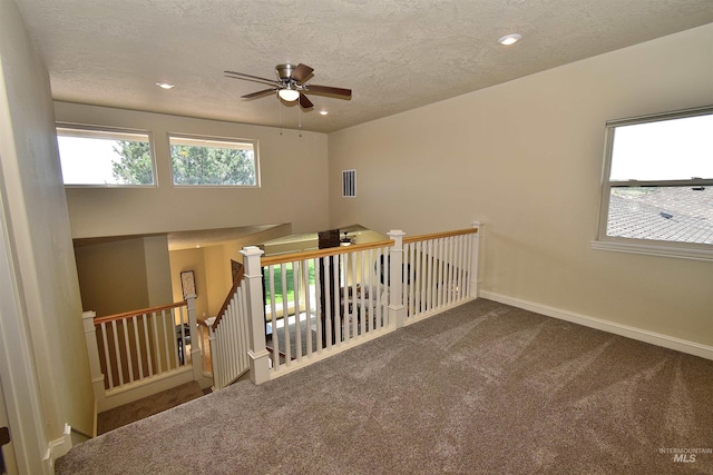 interior space with visible vents, baseboards, a ceiling fan, carpet floors, and recessed lighting