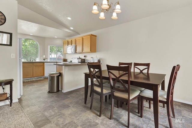 3719 E Sandyford Ave, Nampa, ID 83686 - dining space with lofted ceiling, recessed lighting, a chandelier, and stone finish floors