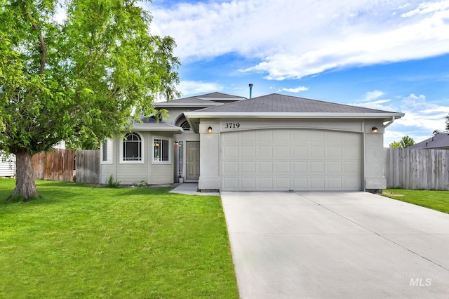 3719 E Sandyford Ave, Nampa, ID 83686 - view of front of house with concrete driveway, an attached garage, and a shingled roof