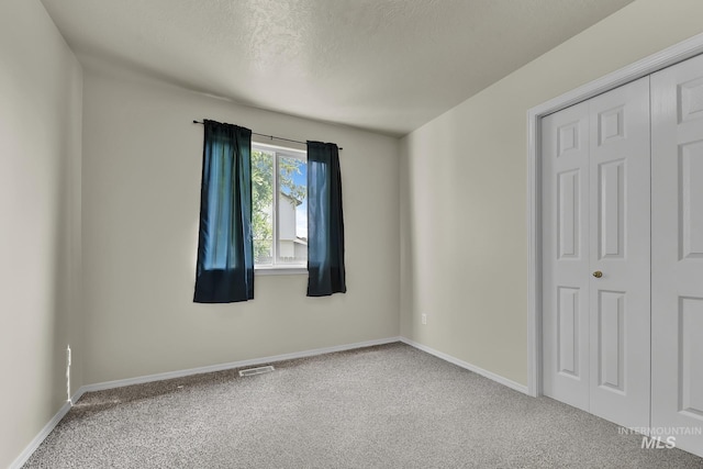 3719 E Sandyford Ave, Nampa, ID 83686 - carpeted empty room featuring a textured ceiling and baseboards