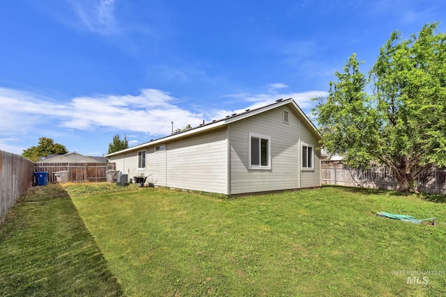 3719 E Sandyford Ave, Nampa, ID 83686 - rear view of house with a fenced backyard