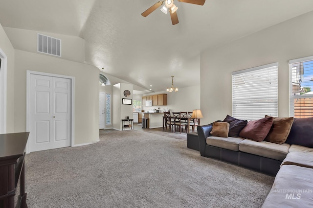 3719 E Sandyford Ave, Nampa, ID 83686 - living room with ceiling fan, light carpet, vaulted ceiling, and a chandelier