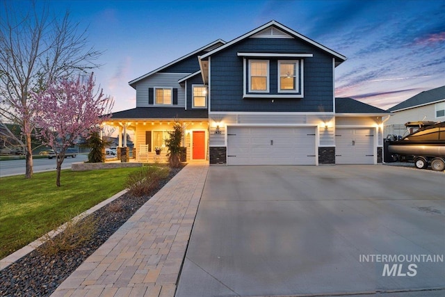 1430 NE Quigley St, Mountain Home, ID 83647 - craftsman house with a yard, a porch, stone siding, an attached garage, and concrete driveway