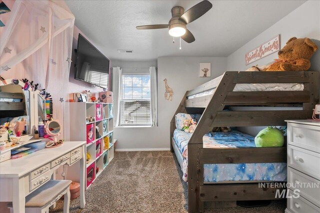 1430 NE Quigley St, Mountain Home, ID 83647 - bedroom with ceiling fan, carpet, a textured ceiling, visible vents, and baseboards