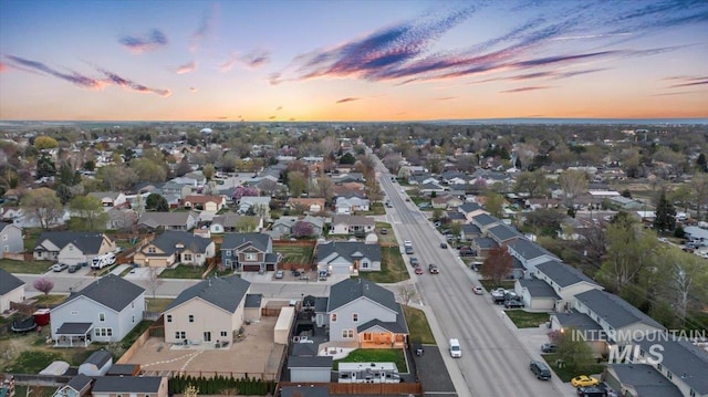 1430 NE Quigley St, Mountain Home, ID 83647 - aerial view at dusk featuring a residential view