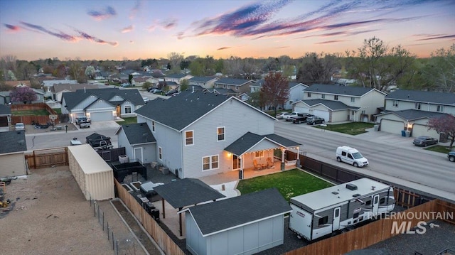 1430 NE Quigley St, Mountain Home, ID 83647 - aerial view at dusk featuring a residential view